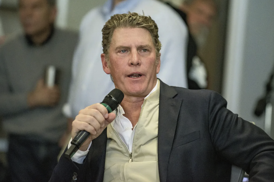 Texas canidate Bo French speaking at an event while holding a microphone